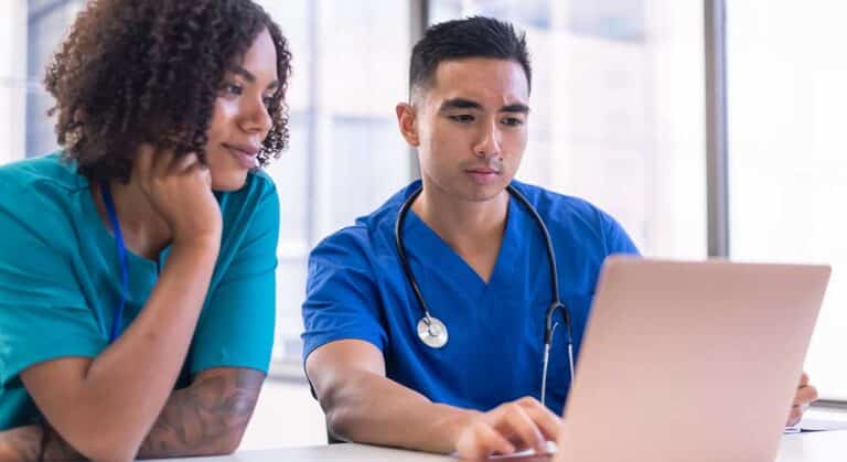 RNs rewriting resume in laptop