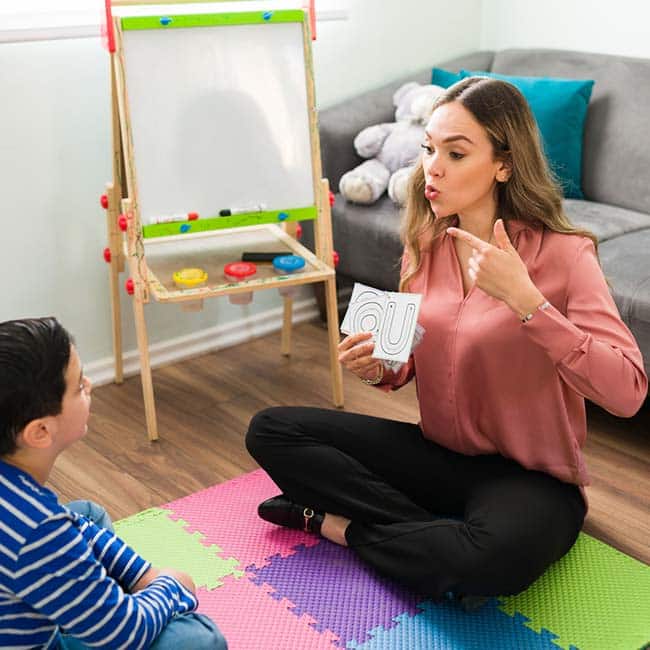 Language therapist in session with student