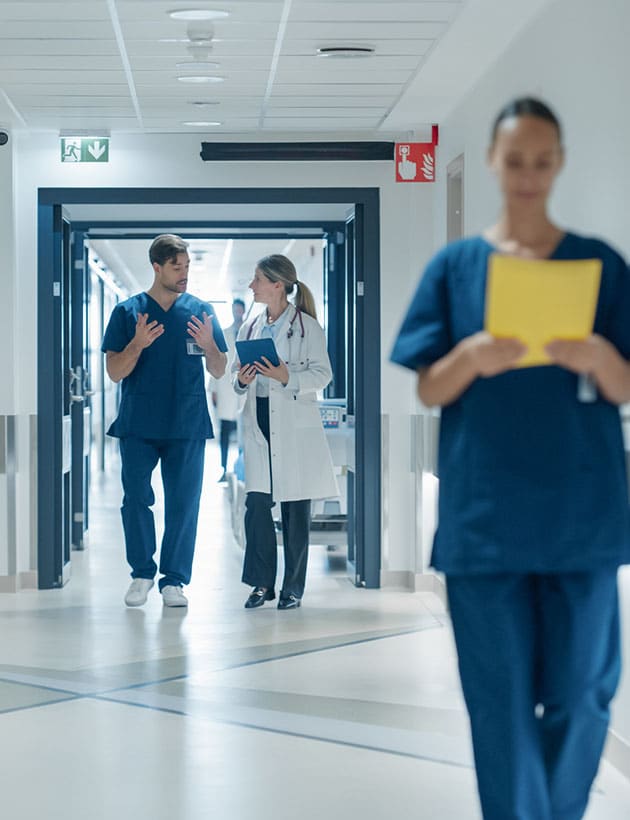 Doctors and nurses in hospital hall