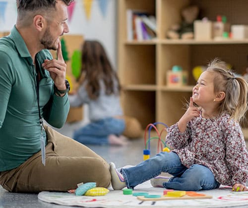 SLP therapist in session with kid