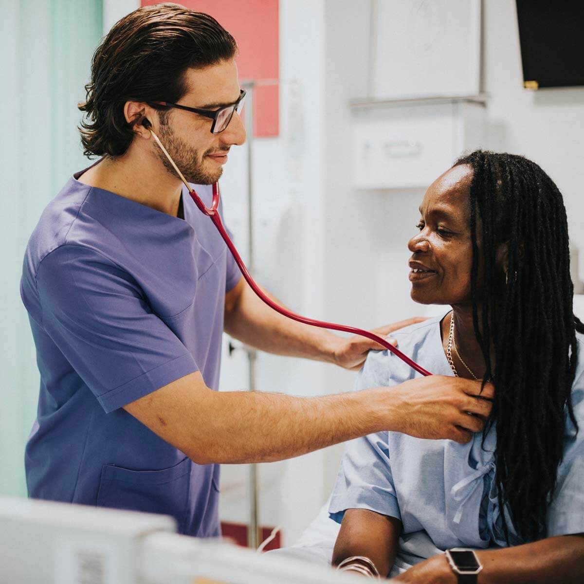 Experienced nurse practitioner checking on patient