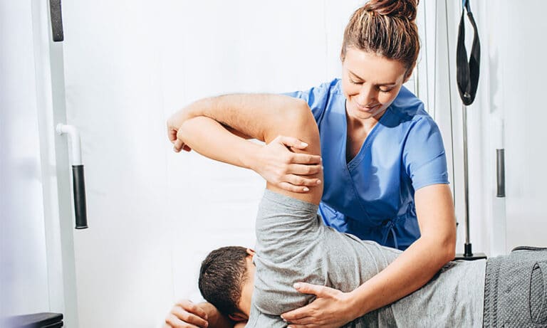 Physical therapist with patient